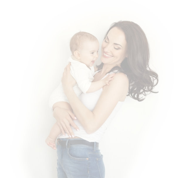 Woman holding a baby, both of them smiling